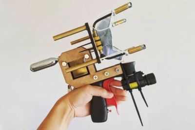Guy Builds Gun That Shoots Masks onto People's Faces